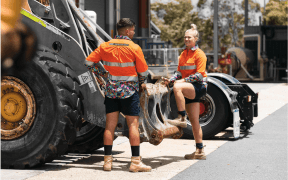 Two workers in funky workwear